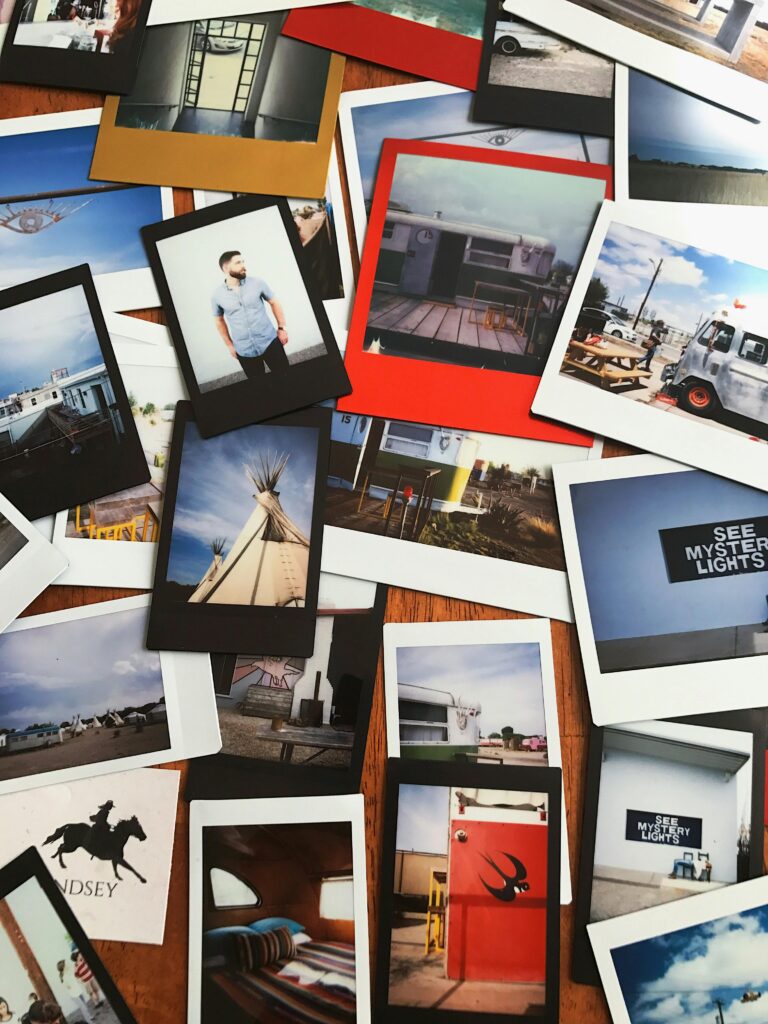 pexels-photo-13860114-13860114 A collection of scattered polaroid photos depicting various scenes and memories in vibrant colors.